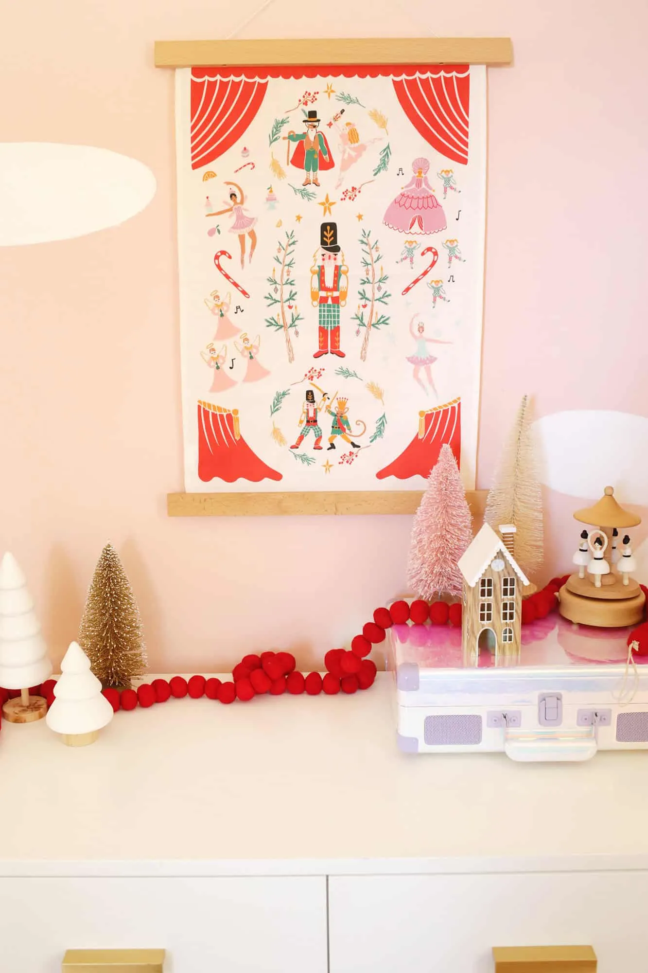 Kid&#x27;s room decorated for the holidays with Christmas sheets and curtains