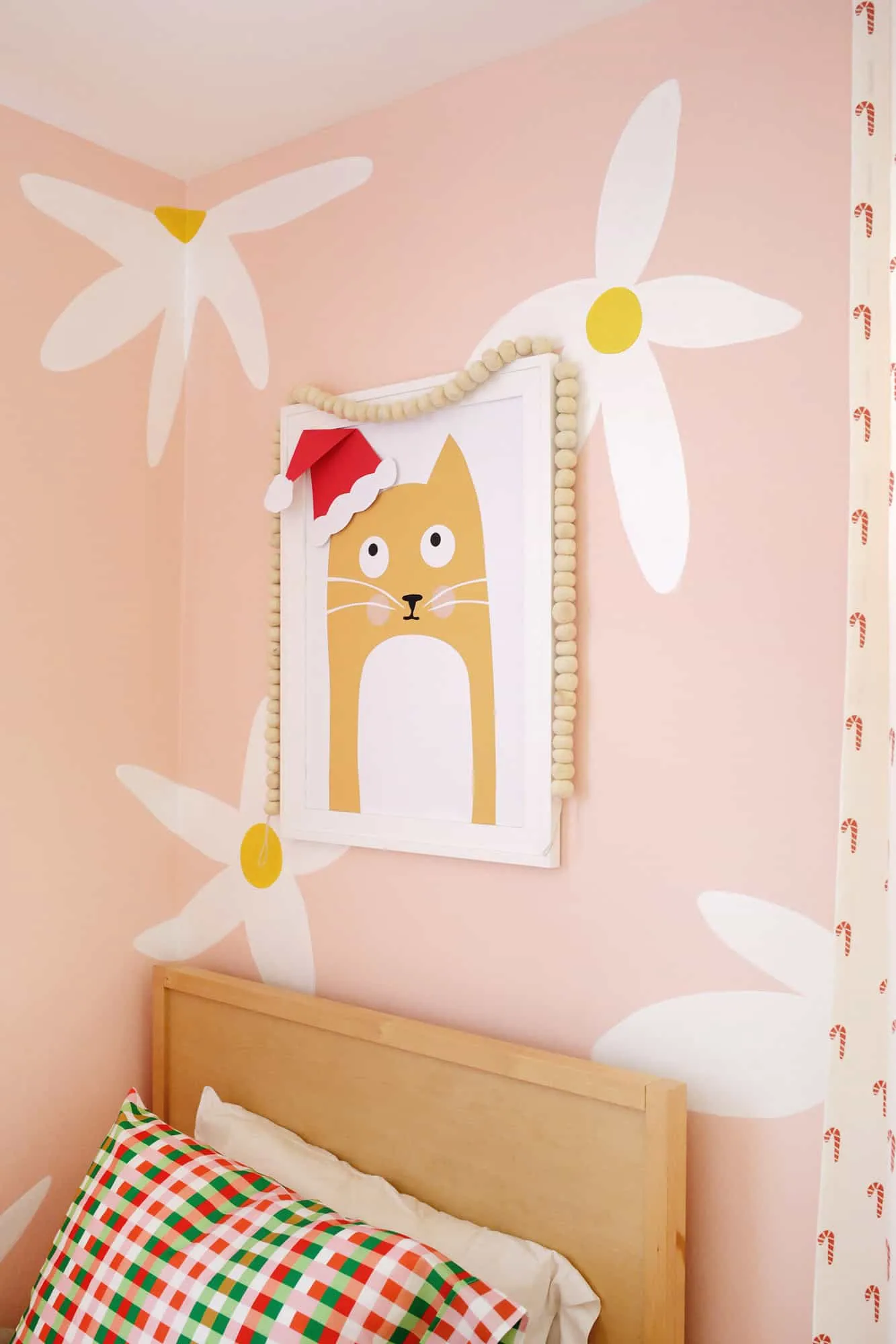 Kid&#x27;s room decorated for the holidays with Christmas sheets and curtains