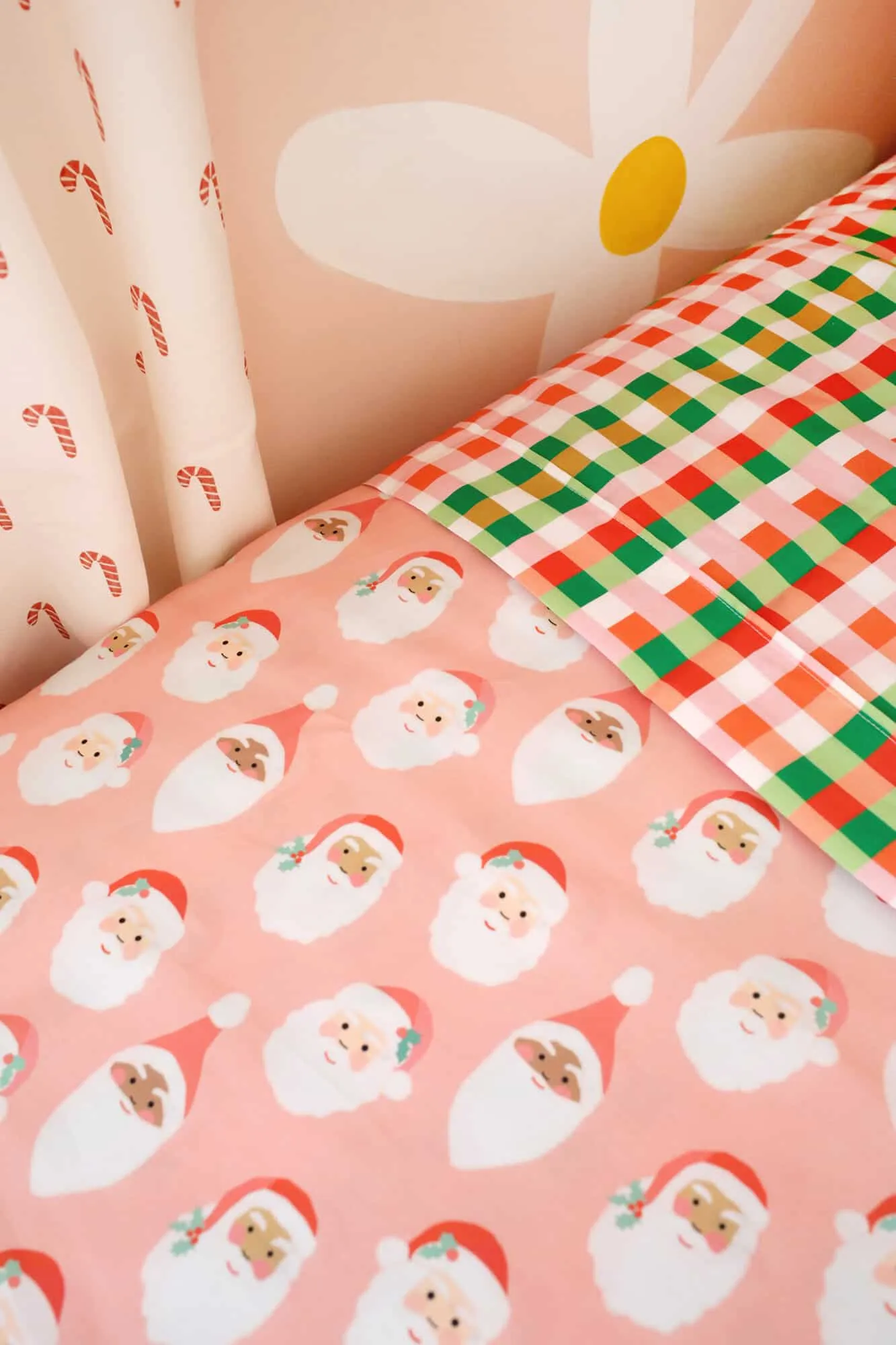 Santa sheets on kid&#x27;s bed for the holidays