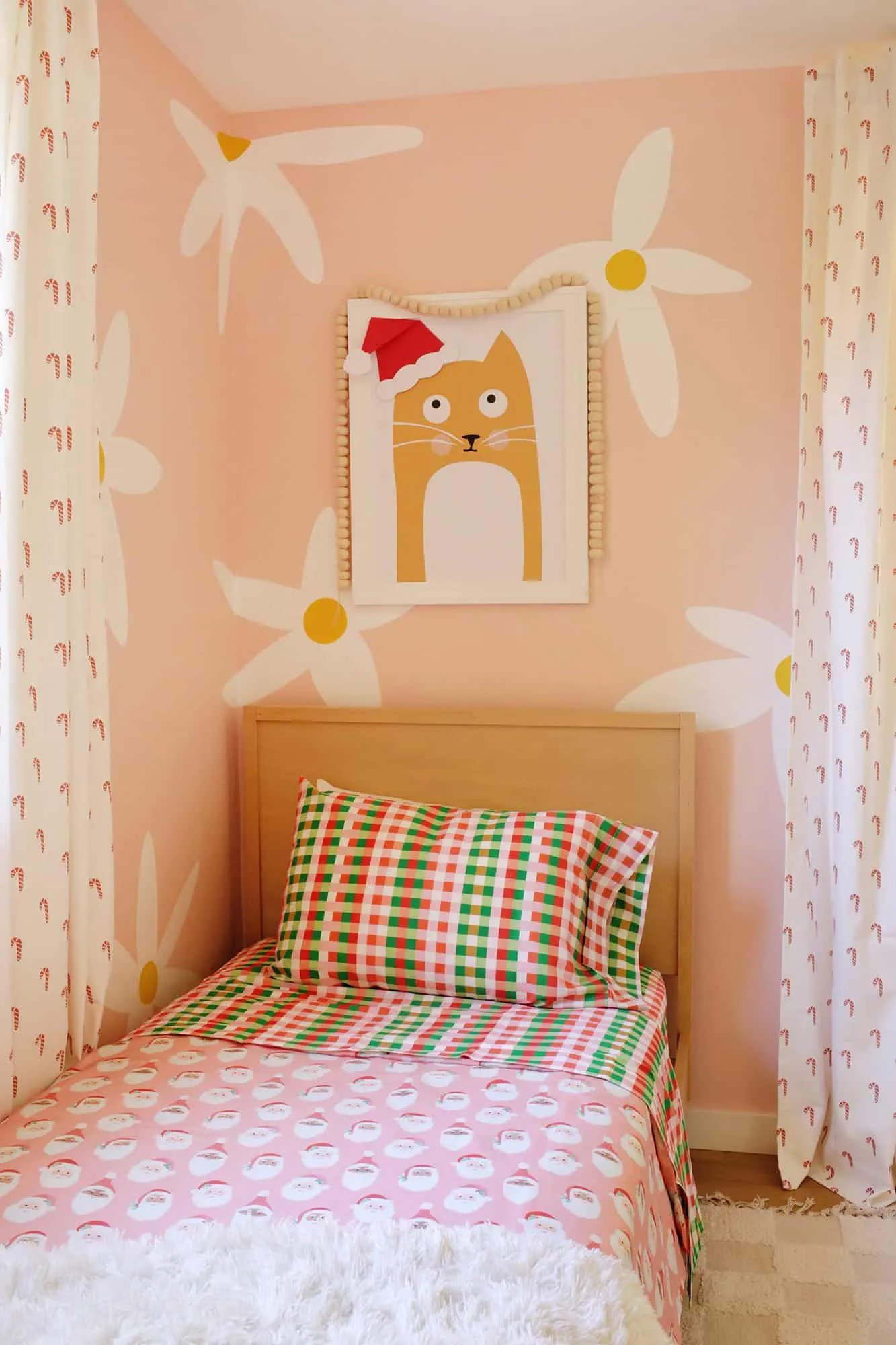 Santa sheets on kid&#x27;s bed for the holidays