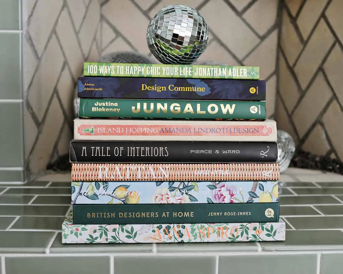 stack of books on tiled fireplace