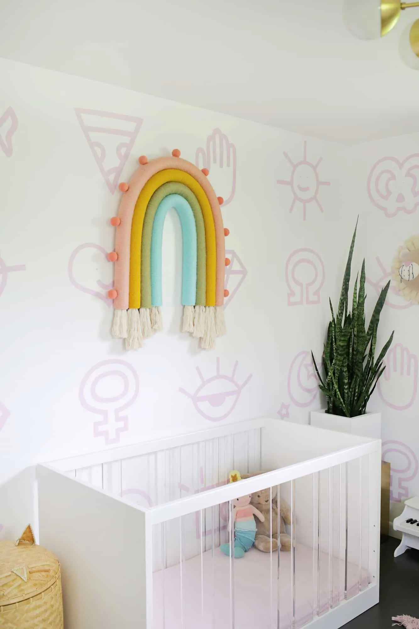 Nursery with a rainbow wall hanging