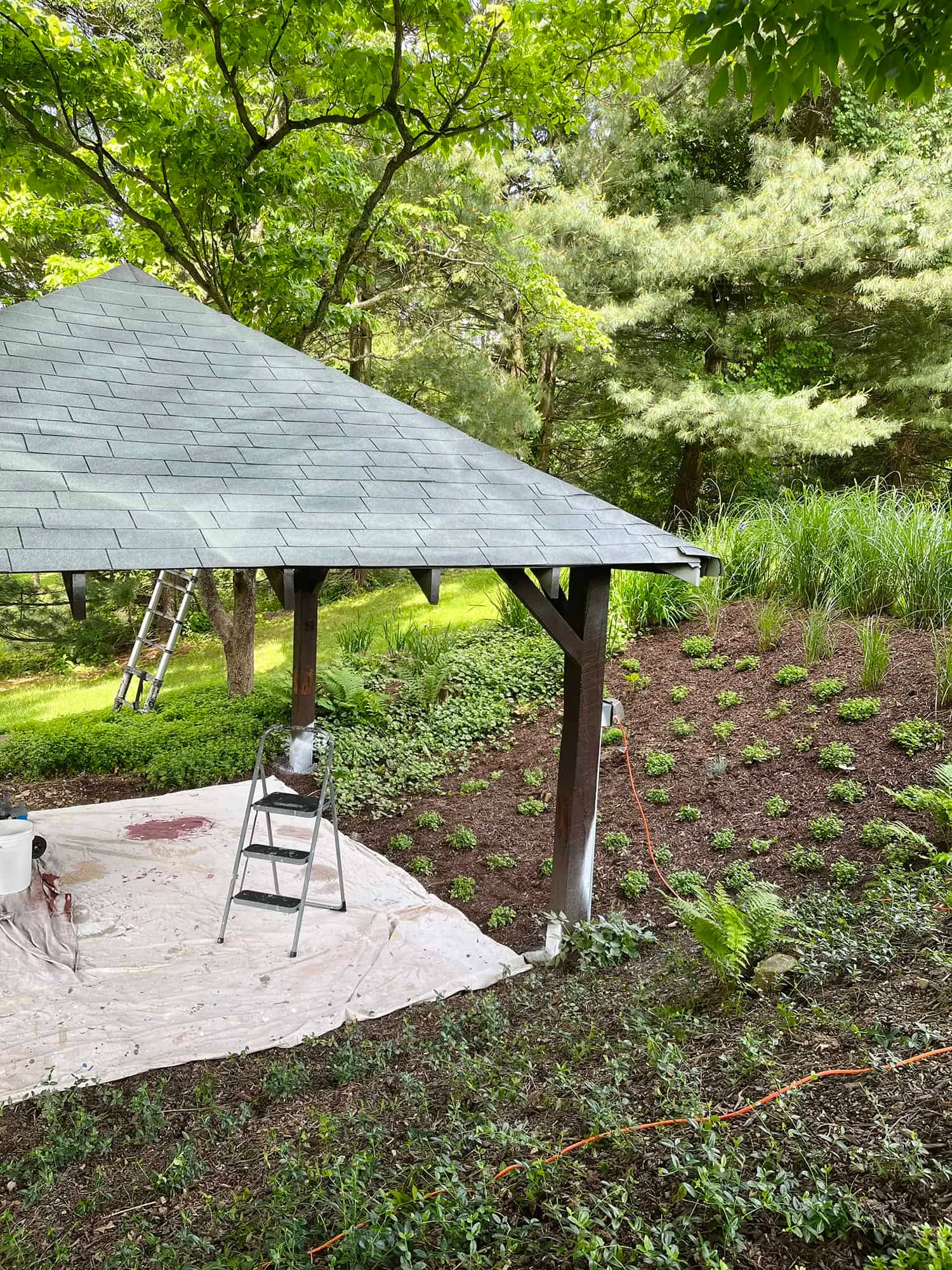 Primer applied on shingle pavilion roof